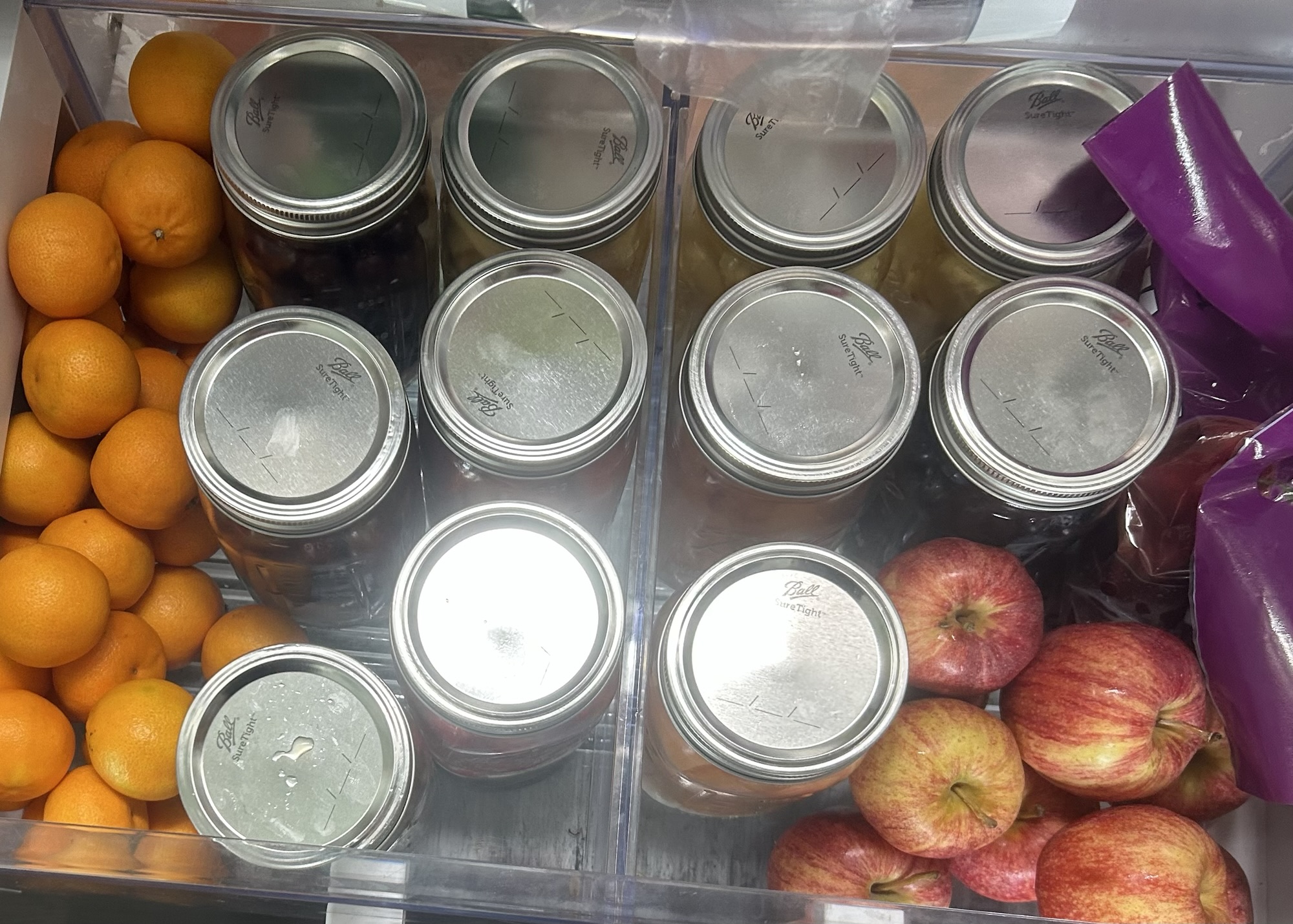 Fridge drawer full of jars
