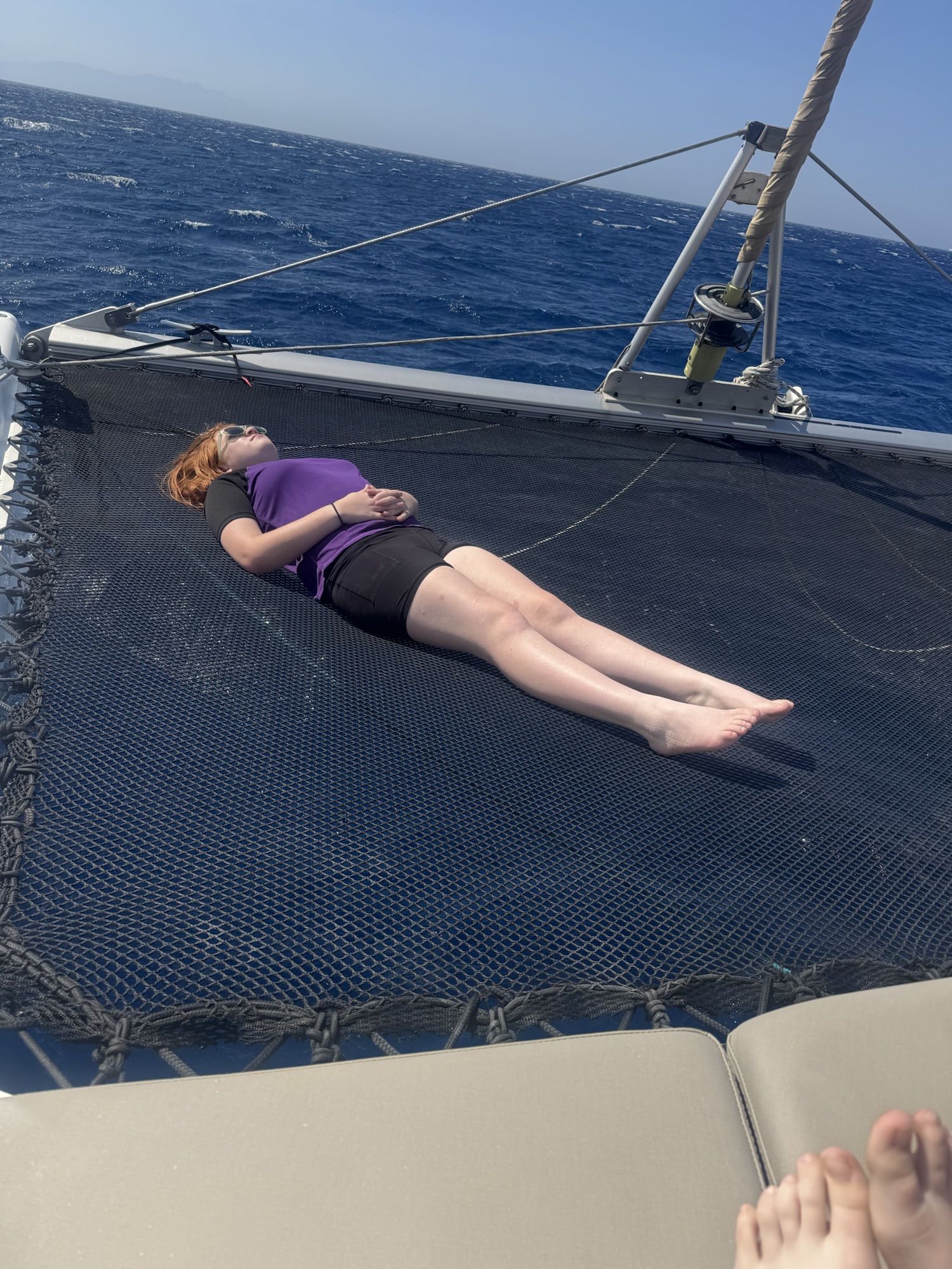 Kids napping on catamaran
